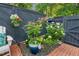 Charming brick patio with mature landscaping, privacy fence, and access to garden at 35 Stonewall Way, Durham, NC 27704