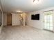 Basement rec room with stairs and walkout doors, great for entertaining at 3504 Rock Creek Dr, Raleigh, NC 27609