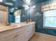 Bright bathroom featuring double vanity with nautical themed wallpaper, perfect for  at 3504 Rock Creek Dr, Raleigh, NC 27609