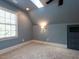 Sunlit bedroom with skylight and built in shelves providing ample storage at 3504 Rock Creek Dr, Raleigh, NC 27609