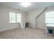 Bright bedroom featuring neutral walls, two windows and built-in desk with ample natural light at 3504 Rock Creek Dr, Raleigh, NC 27609
