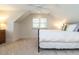 Cozy bedroom with neutral carpet and natural light from a large window at 3504 Rock Creek Dr, Raleigh, NC 27609