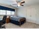 Cozy bedroom with carpet, ceiling fan, closet and window, inviting comfort at 3504 Rock Creek Dr, Raleigh, NC 27609