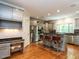 Spacious kitchen with stainless steel appliances, custom cabinets, and a stylish island at 3504 Rock Creek Dr, Raleigh, NC 27609