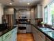 Elegant kitchen with stainless steel appliances and lots of counter space at 3504 Rock Creek Dr, Raleigh, NC 27609