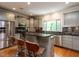 Well-equipped kitchen with stainless steel appliances and ample counter space at 3504 Rock Creek Dr, Raleigh, NC 27609