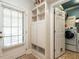 Mudroom with built-in storage and laundry area at 3504 Rock Creek Dr, Raleigh, NC 27609