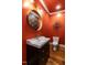 Striking powder room with modern fixtures and bold design at 3504 Rock Creek Dr, Raleigh, NC 27609