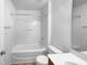 Bathroom featuring a tub and shower combo, toilet, and vanity in a bright, neutral-toned room at 351 Gilman Ln # 109, Raleigh, NC 27610