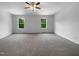 Spacious, light-filled bedroom features neutral carpet and two large windows at 351 Gilman Ln # 109, Raleigh, NC 27610