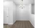 Dining room featuring a chandelier and neutral carpeting in a bright, neutral-toned room at 351 Gilman Ln # 109, Raleigh, NC 27610
