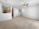 Open living room with staircase, ceiling fan, and view to kitchen area at 351 Gilman Ln # 109, Raleigh, NC 27610