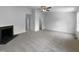 Spacious living room with fireplace, ceiling fan, and access to closet at 351 Gilman Ln # 109, Raleigh, NC 27610