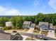 Aerial view of the green and blue homes showcases the neighborhood's curb appeal at 403 Prestwood Dr, Hillsborough, NC 27278