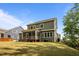 Expansive backyard featuring a screened porch, well-maintained lawn, and partial shade from trees at 403 Prestwood Dr, Hillsborough, NC 27278