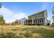 A backyard with a well-kept lawn, patio and wooden fence with a playground at 403 Prestwood Dr, Hillsborough, NC 27278