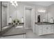 Modern bathroom featuring double sinks, sleek white cabinets, and stylish mirrors at 403 Prestwood Dr, Hillsborough, NC 27278