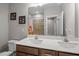 Bathroom with double sinks, tile shower, and neutral color palette at 403 Prestwood Dr, Hillsborough, NC 27278