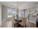 Beautiful dining room with tray ceiling, a decorative chandelier and view of stairway and entryway at 403 Prestwood Dr, Hillsborough, NC 27278