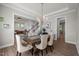 Dining room featuring table, chairs, chandelier, and doorway views to the entry and living areas at 403 Prestwood Dr, Hillsborough, NC 27278