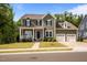 Classic home with inviting front porch and two-car garage provides ample parking at 403 Prestwood Dr, Hillsborough, NC 27278