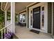 Inviting front porch with chairs and plants, perfect for relaxing and enjoying the outdoors at 403 Prestwood Dr, Hillsborough, NC 27278