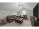 Comfortable upstairs bonus room with a vaulted ceiling, plenty of seating, and natural light at 403 Prestwood Dr, Hillsborough, NC 27278