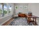 Bright home office featuring multiple windows and a spacious desk for work or study at 403 Prestwood Dr, Hillsborough, NC 27278