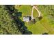 Aerial view of home on well-maintained land surrounded by lush trees at 407 Howard Tant Rd, Zebulon, NC 27597