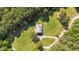 Aerial view of house on beautifully manicured lot surrounded by trees at 407 Howard Tant Rd, Zebulon, NC 27597