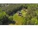 Aerial view of beautiful rural land featuring lush trees, green grass and home at 407 Howard Tant Rd, Zebulon, NC 27597