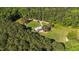 Aerial perspective of home on expansive lot featuring a well-manicured lawn and driveway at 407 Howard Tant Rd, Zebulon, NC 27597