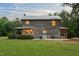 View of backyard with a spacious yard and covered porch at 407 Howard Tant Rd, Zebulon, NC 27597