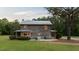 Back exterior view featuring spacious yard with patio perfect for outdoor enjoyment at 407 Howard Tant Rd, Zebulon, NC 27597