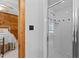 This bathroom features a glass enclosed shower with white tile and black accents at 407 Howard Tant Rd, Zebulon, NC 27597