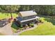 An aerial front elevation view featuring a cozy two-story home and attractive landscaping at 407 Howard Tant Rd, Zebulon, NC 27597