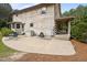 Side view of a log home with a concrete patio and covered porch for outdoor enjoyment at 407 Howard Tant Rd, Zebulon, NC 27597