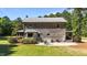 Rear exterior showcasing the outdoor patio of this stunning two-story home at 407 Howard Tant Rd, Zebulon, NC 27597