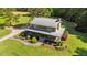 Stunning log home with metal roof, wrap-around porch, and beautiful landscaping at 407 Howard Tant Rd, Zebulon, NC 27597