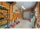 Garage interior featuring an open design, shelves, pegboard, and various equipment at 407 Howard Tant Rd, Zebulon, NC 27597