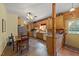 Spacious kitchen featuring tile floors, wooden table, and modern appliances at 407 Howard Tant Rd, Zebulon, NC 27597