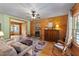 Inviting living room with hardwood floors, stone fireplace, and cozy furniture at 407 Howard Tant Rd, Zebulon, NC 27597