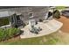 View of the home's patio area with outdoor seating and neatly landscaped yard at 407 Howard Tant Rd, Zebulon, NC 27597