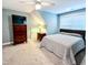 Bedroom featuring sloped ceiling, carpeted floor, side table and dresser with TV at 409 Eagle Ct, Henderson, NC 27536