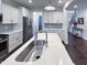 Kitchen featuring stainless appliances and a view of the staircase at 409 Eagle Ct, Henderson, NC 27536