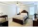 Relaxing main bedroom with trey ceiling, soft carpet, and lots of natural light at 409 Eagle Ct, Henderson, NC 27536