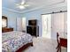 Spacious main bedroom with a view into the main bathroom, and a stylish sliding door at 409 Eagle Ct, Henderson, NC 27536