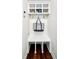 Mudroom with built-in storage bench, cubbies, hooks, and dark wood floors, perfect for organization at 409 Eagle Ct, Henderson, NC 27536
