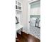 Convenient mudroom with a bench, storage, and a view of the laundry room at 409 Eagle Ct, Henderson, NC 27536