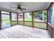 Spacious screened porch with wood flooring and views of the backyard, ideal for outdoor enjoyment at 409 Eagle Ct, Henderson, NC 27536
